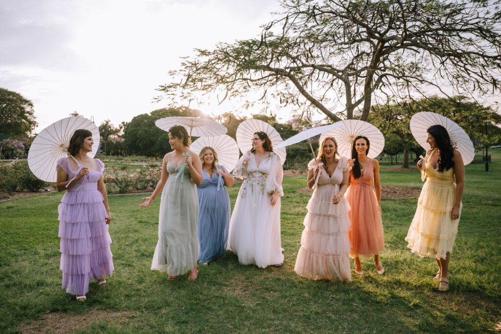 brisbane wedding photography of colourful bridal party with umbrellas