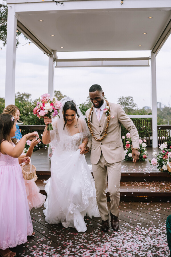 couple walking down the aisle after ceremony at Victoria Park wedding venue