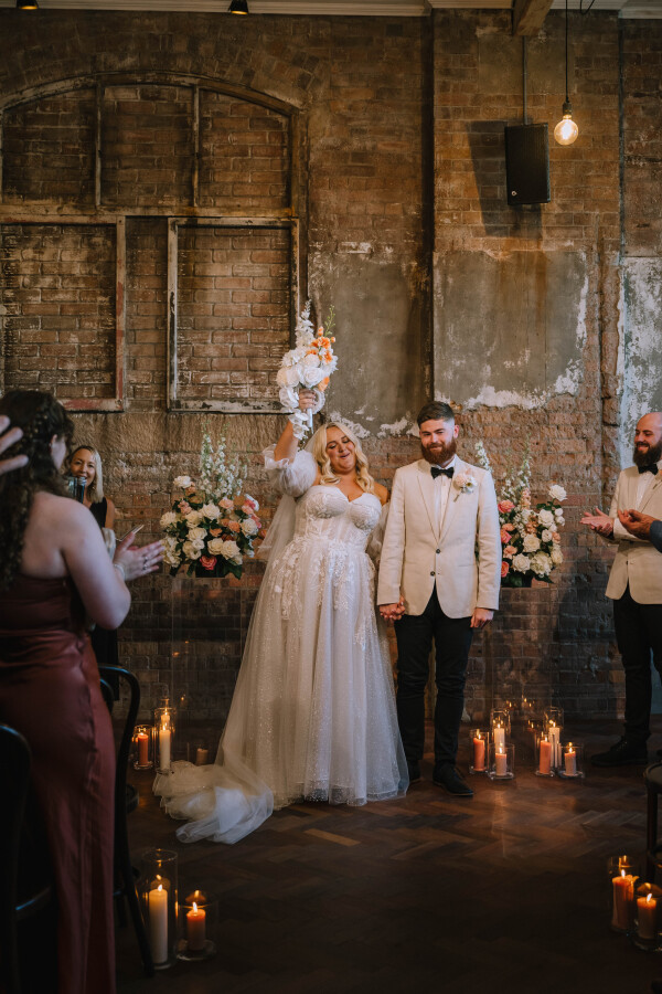 newly married bride and groom photography at the warehouse wedding venue