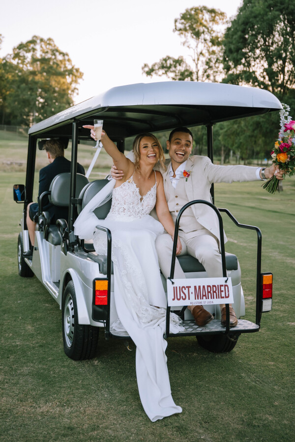 couple sitting on just married golf cart at Hillstone St Lucia