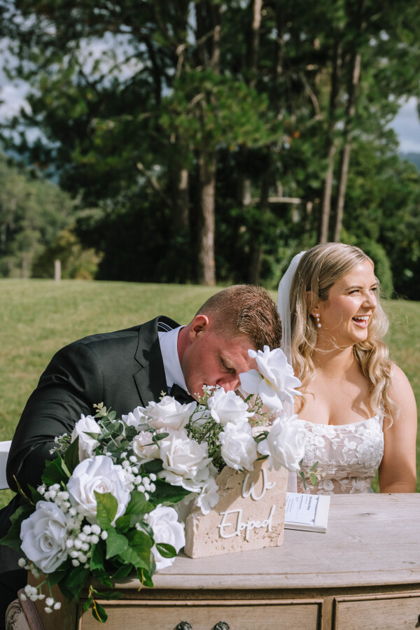 Intimate moment captured between couple post-ceremony