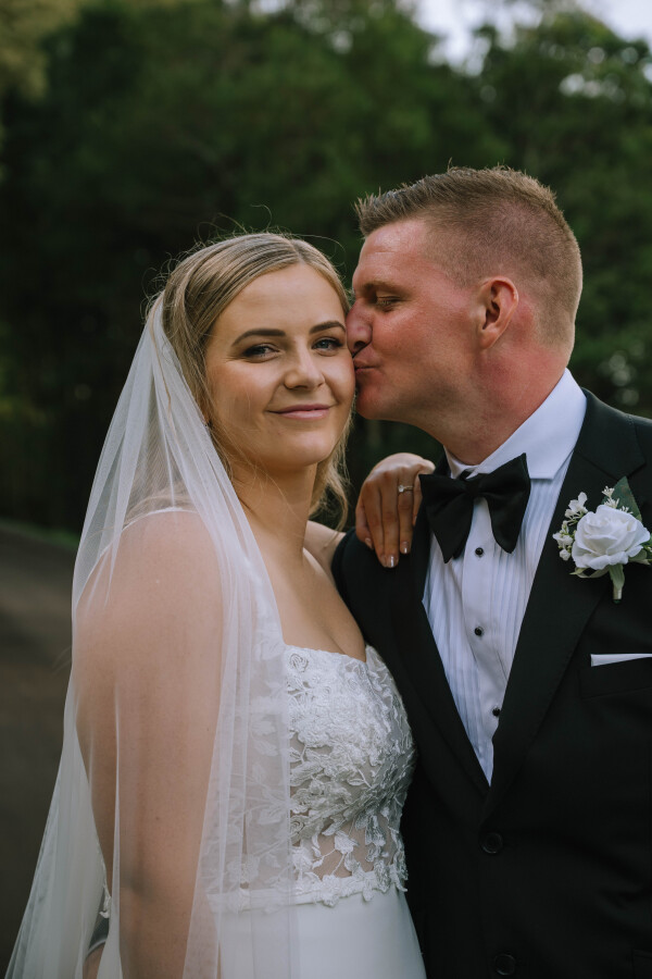 Intimate moment captured between couple post-ceremony