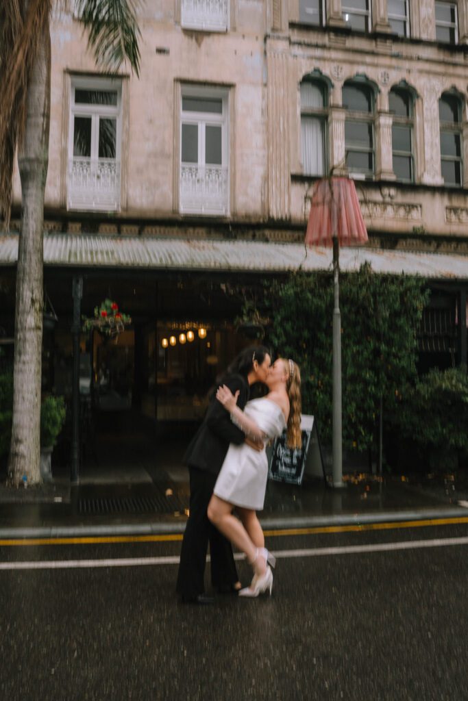 couple kissing in the rain 