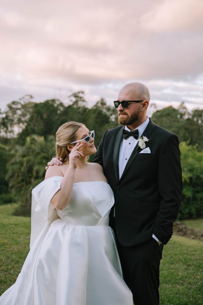 bride and groom wearing sunglasses after wedding ceremony at Maleny Manor in the sunshine coast hinterland