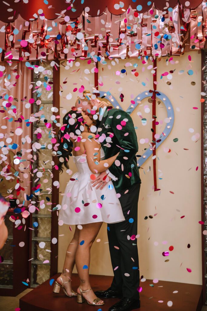 confetti explosion as the couple kiss after elopement ceremony in brisbane cbd
