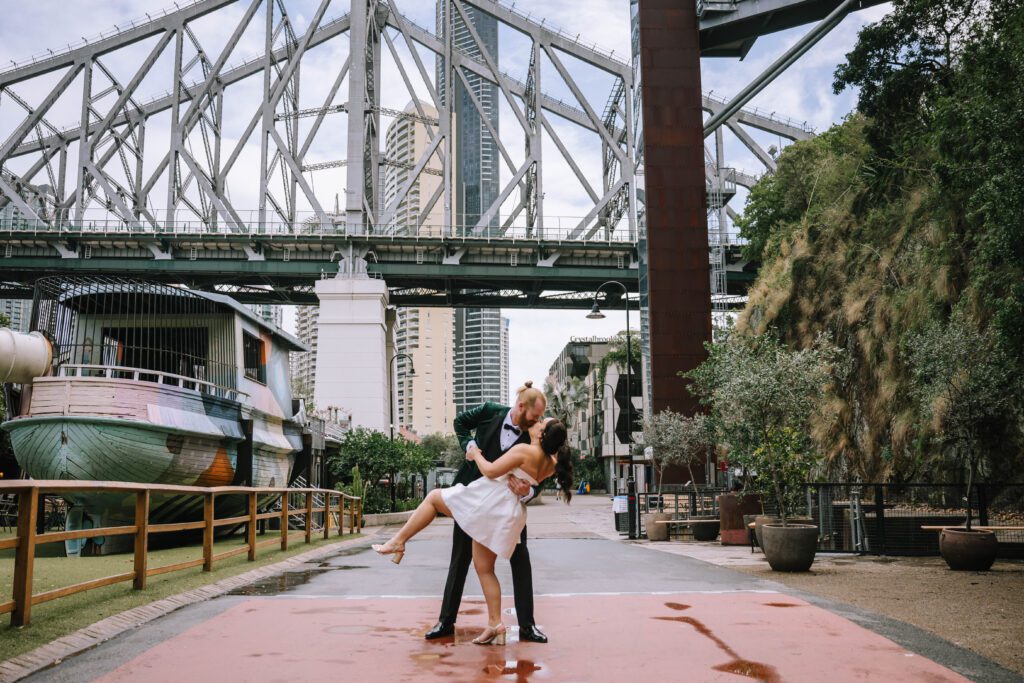 romantic landscape shot of couple kissing after elopement ceremony