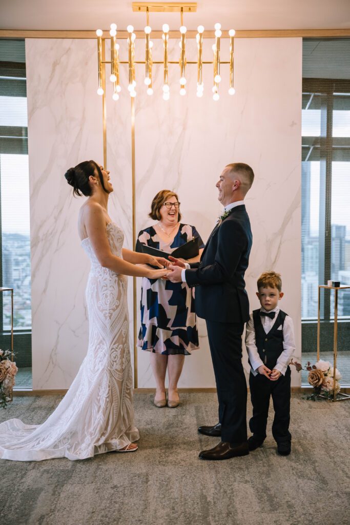 couple laughing during their vows at brisbane registry legal ceremony 