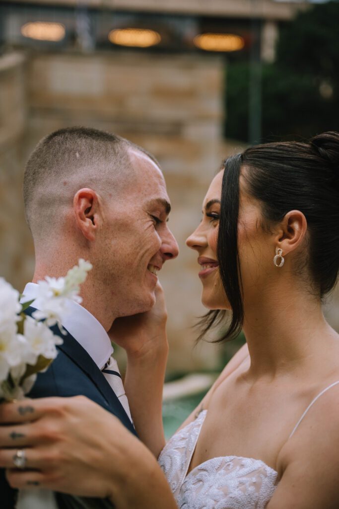 close up shot of bride and groom embracing after intimate elopement in brisbane