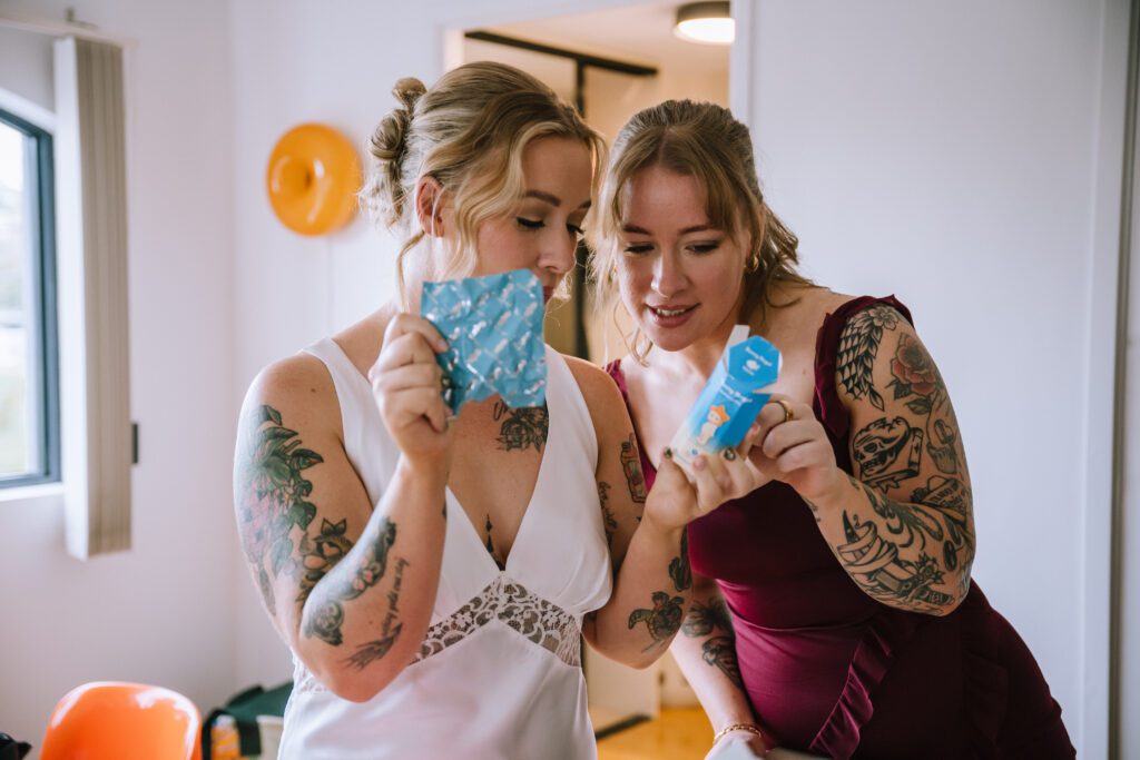 bride and bridesmaid opening sonny angel blind box while getting ready 