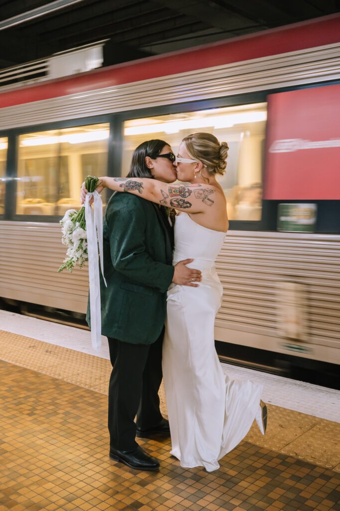 couple embracing as train goes past