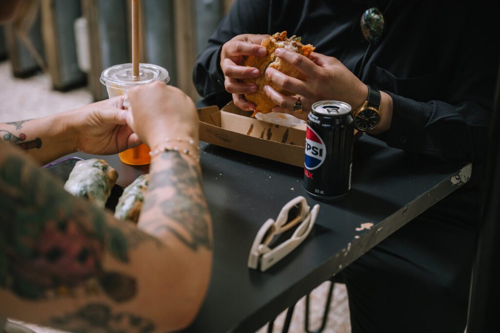 close up of couple enjoying a quick snack after their brisbane elopement ceremony 