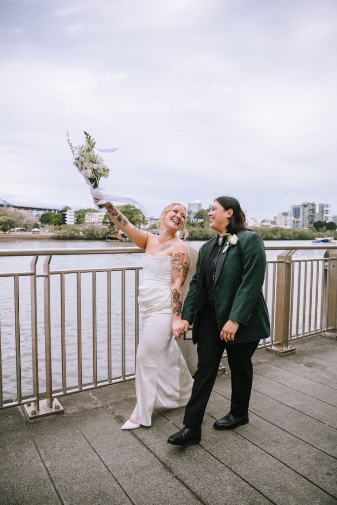 brides walking on the bridge towards howard smith wharves