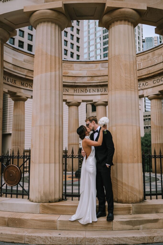 editorial portrait of couple kissing after  elopement at new farm park 