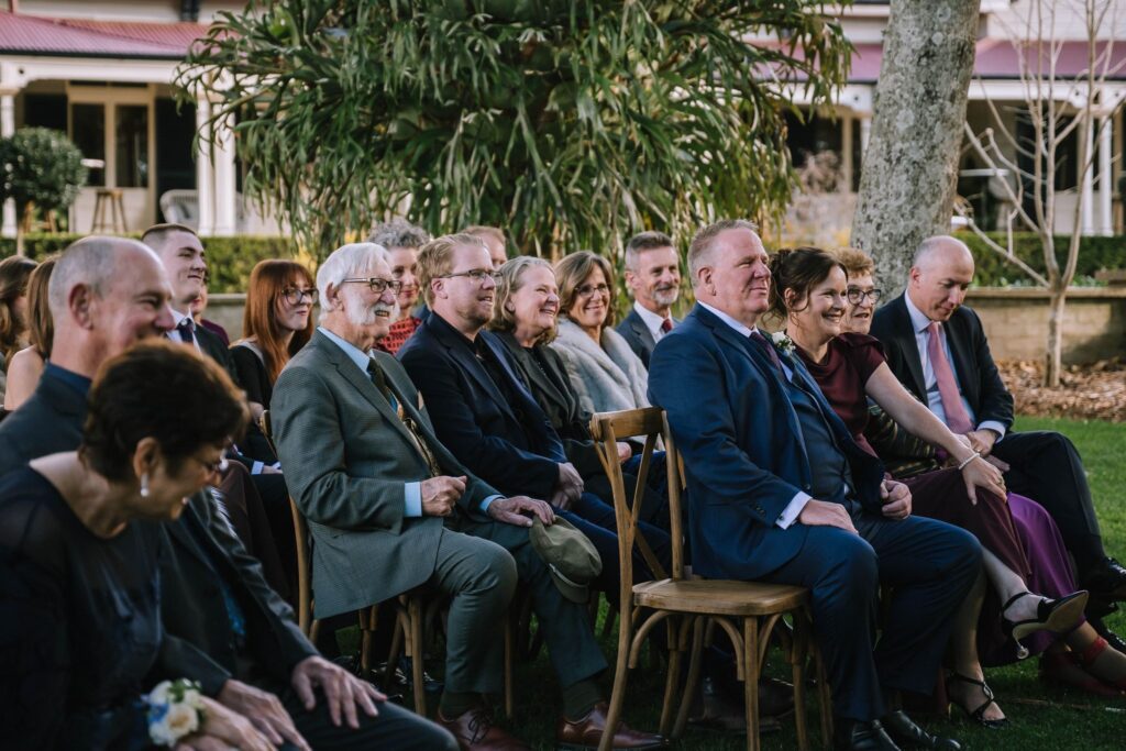 documentary style portrait of guest reactions during wedding ceremony at gabbinar homestead