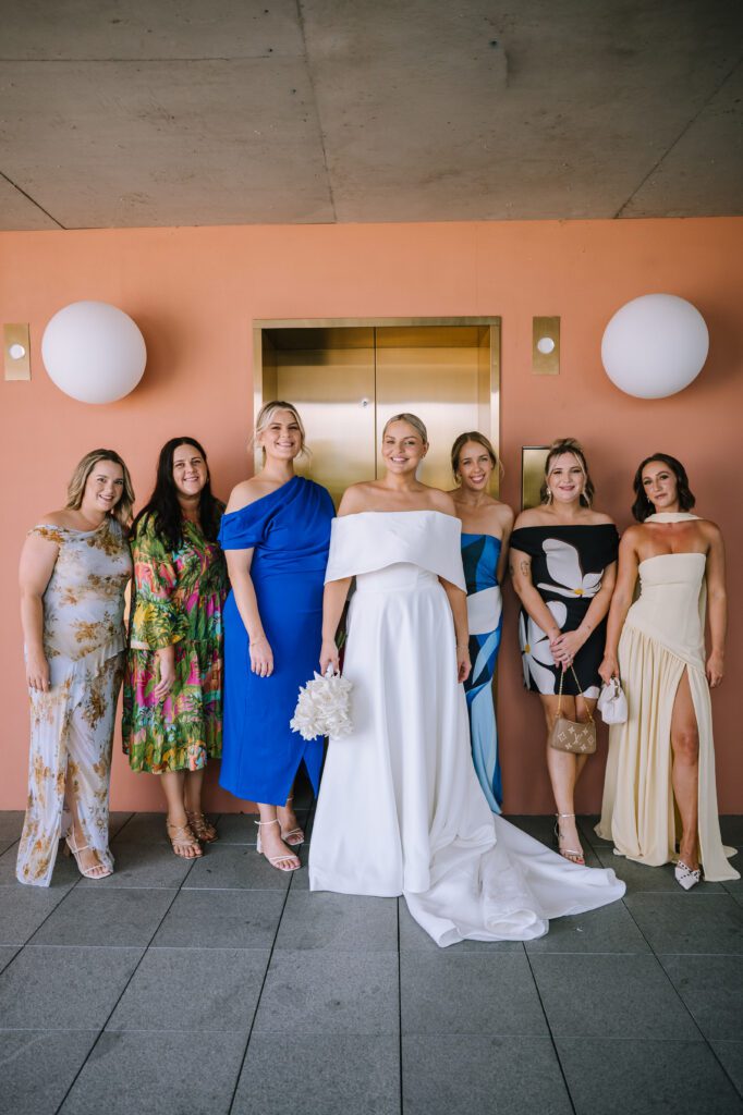 bridal party portrait outside the lift on the rooftop at the calile hotel 