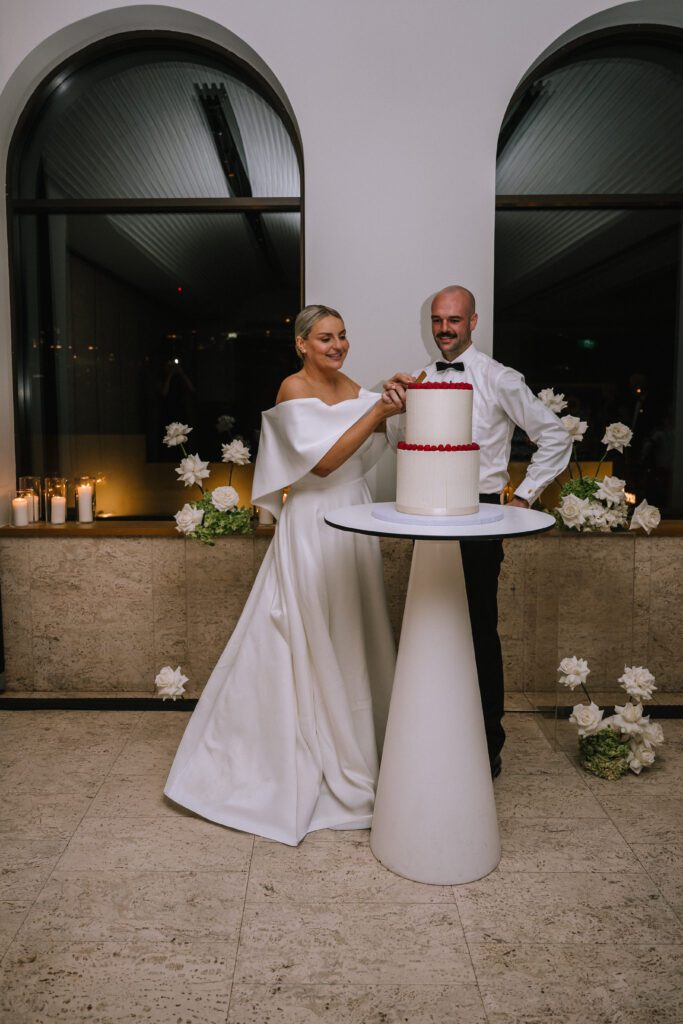 bride and groom cutting the cake during wedding reception at the calile hotel in brisbane