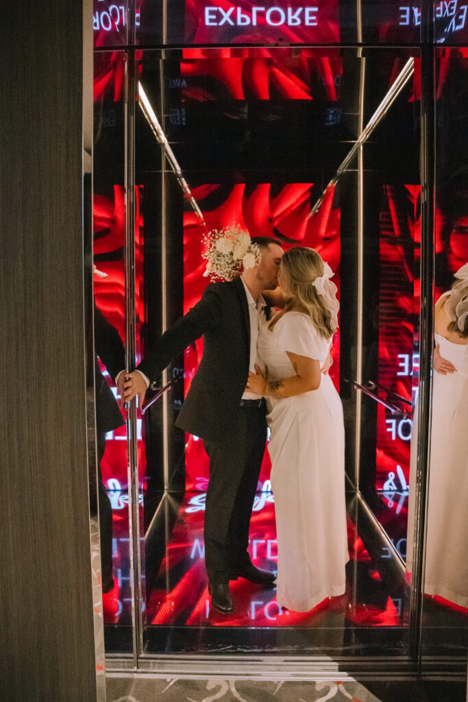 couple kissing in the elevator at Emporium Hotel South Bank in brisbane