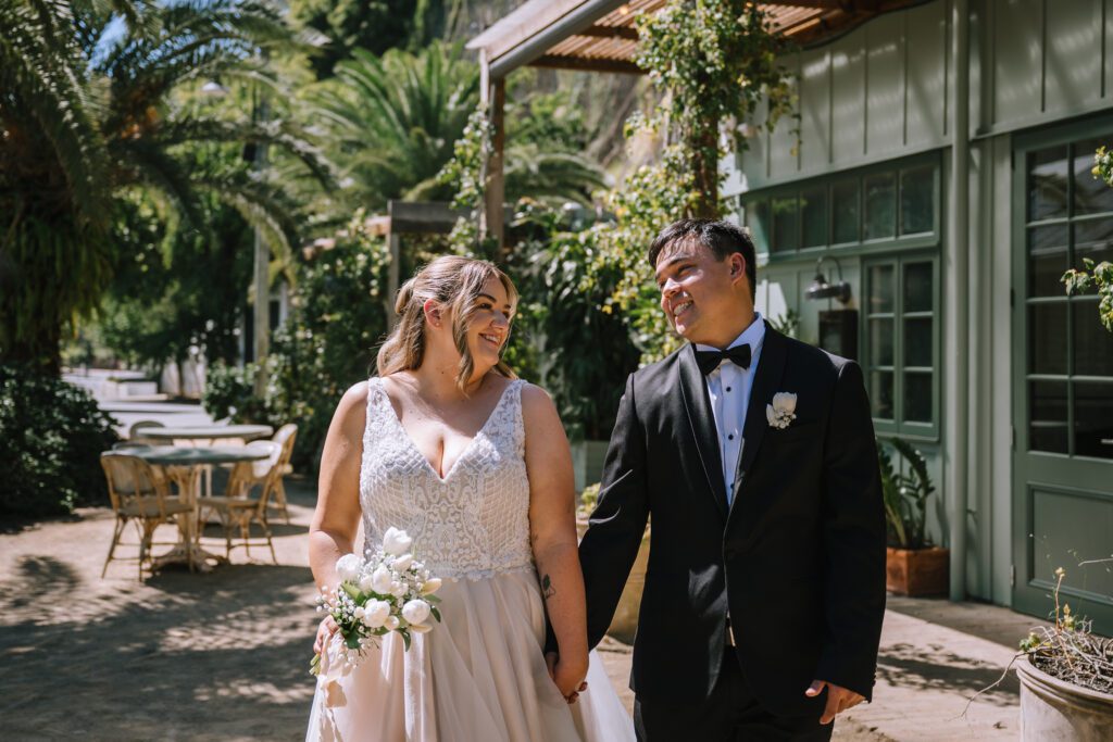 happy couple outside the Crystalbrook Vincent hotel wedding venue in brisbane CBD