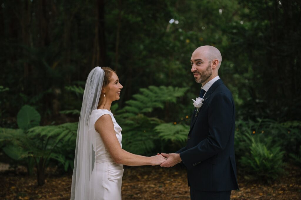 digital photograph of couple holding hands during outdoor ceremony in brisbane