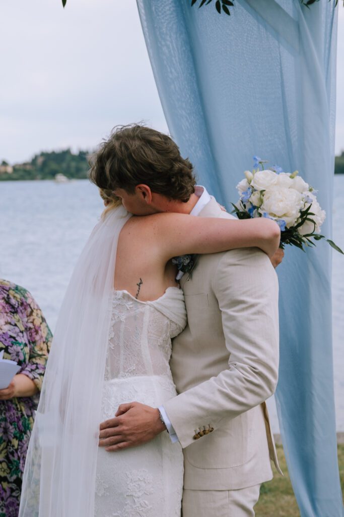 couple embracing after seeing each other for the first time before ceremony officially begins