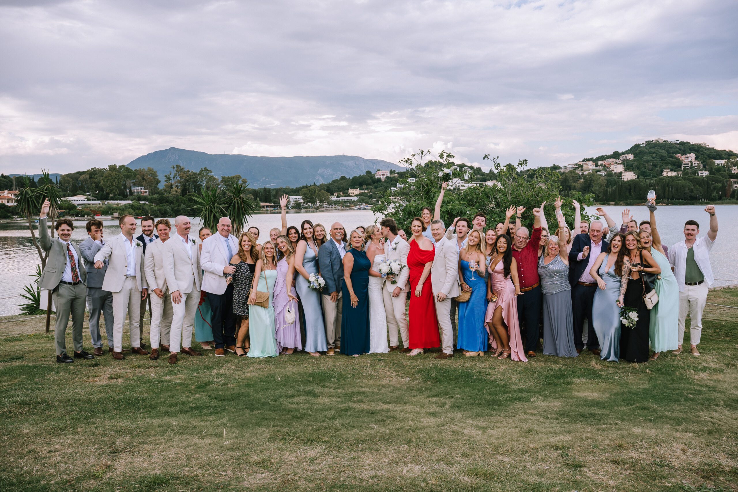 group shot of the newlyweds with all their guests after wedding ceremony at Hyatt Ziva Corfu in Greece