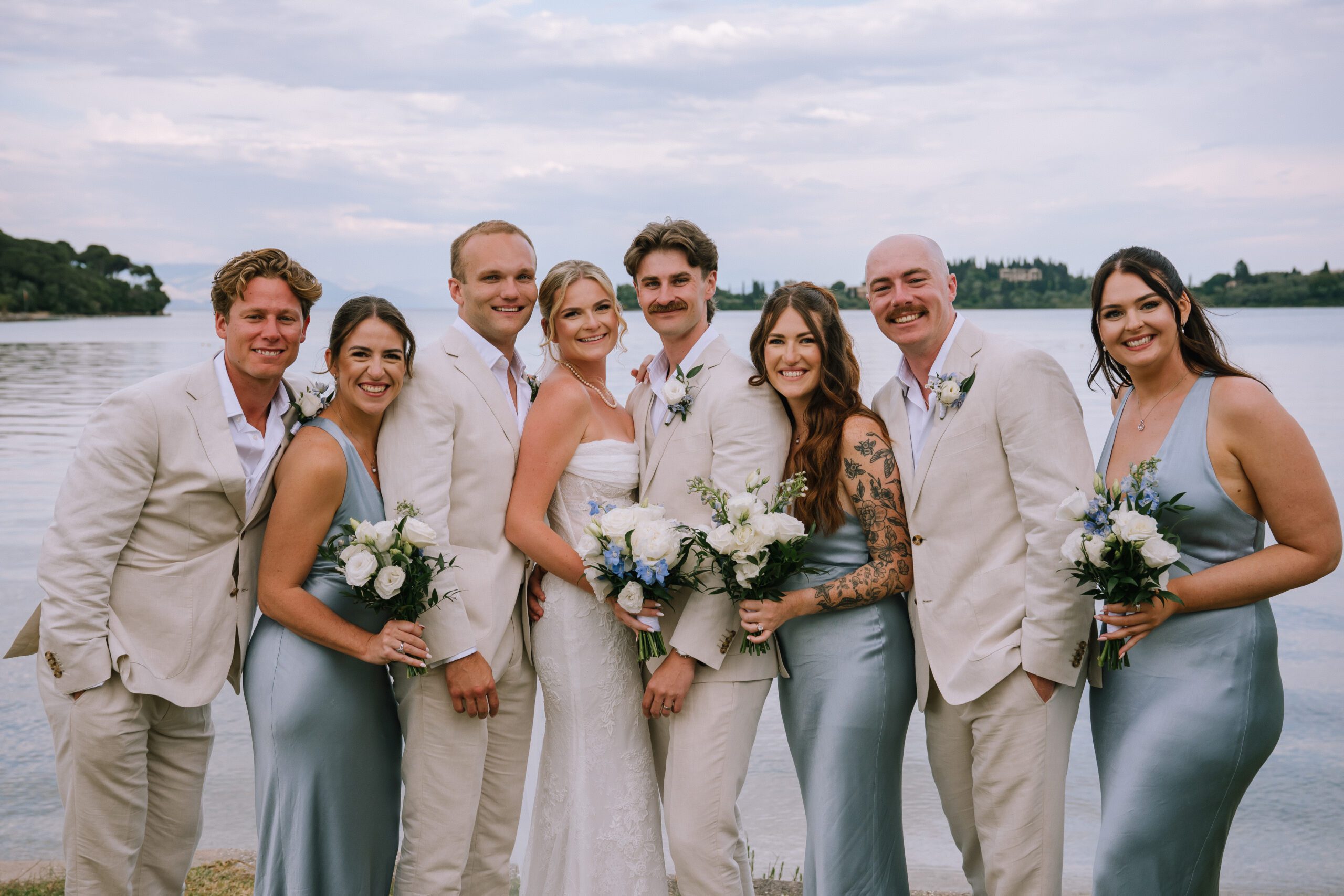 traditional style portrait of couple with their wedding party