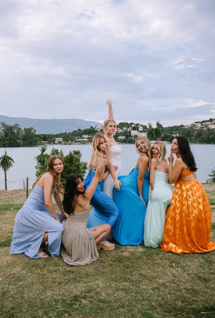 bride posing with her friends after wedding ceremony