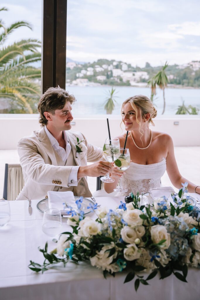 happy couple toasting each other during wedding reception